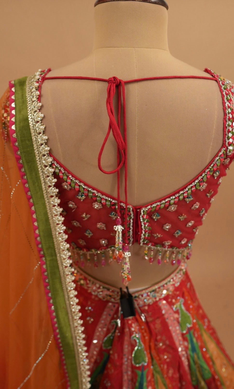 Orange Multicolor Heavy Embroidered Party Wear Lehenga Set